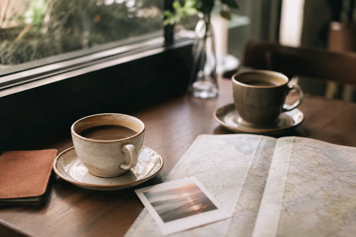 Anniversary date setup with printed itinerary and two coffee cups
