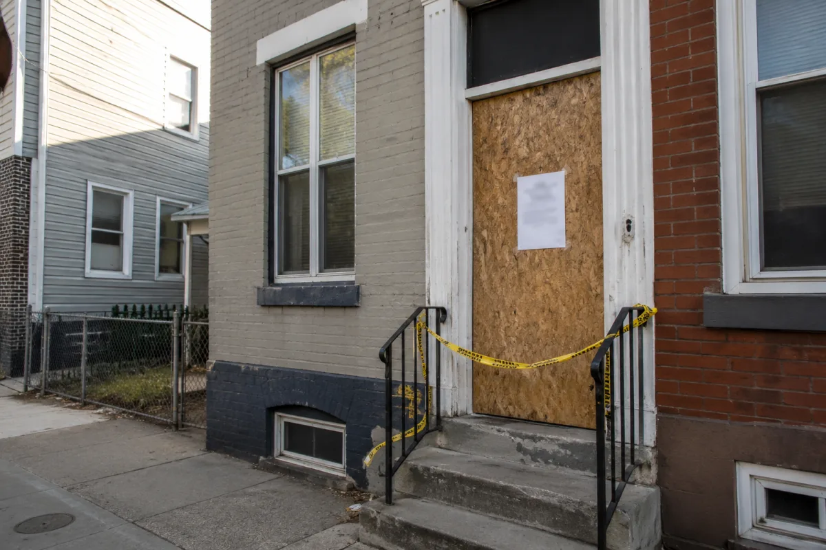Condemned property notice on boarded door