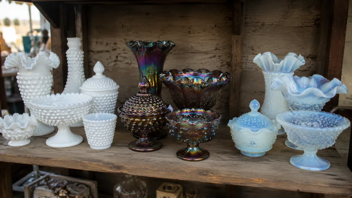 Several Fenton style glass pieces grouped by color and pattern