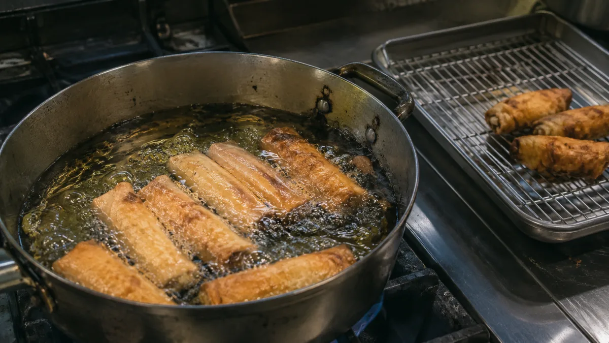 Vietnamese-style egg rolls frying