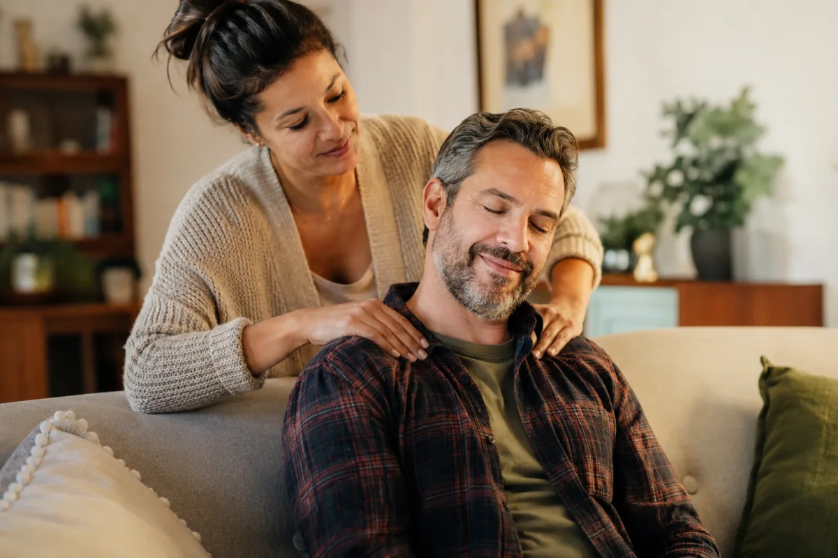 Respectful shoulder massage with consent at home