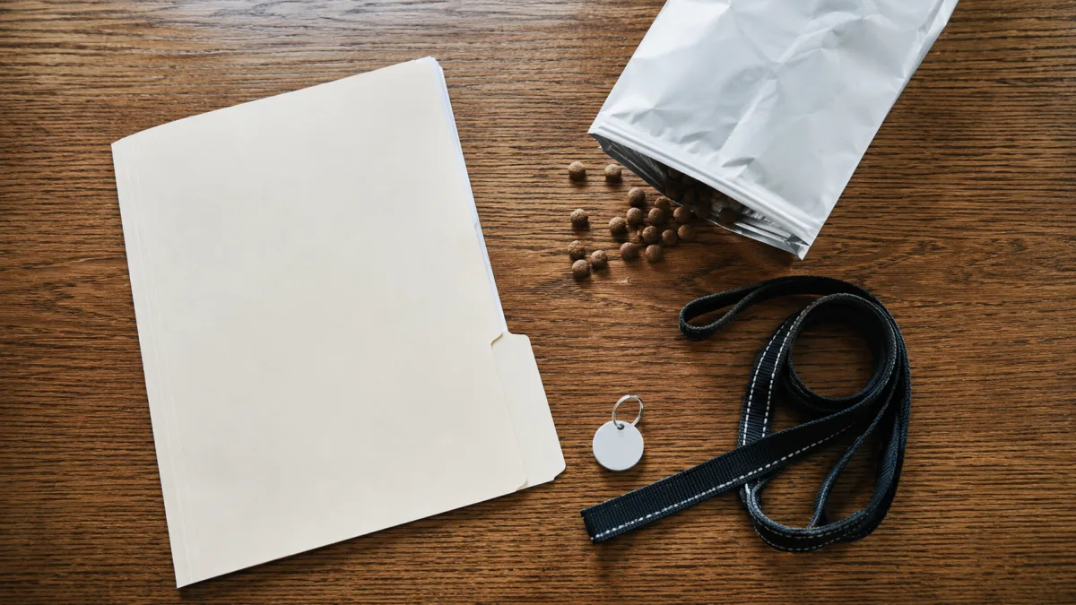 Puppy contract folder, leash, and food instructions on a table