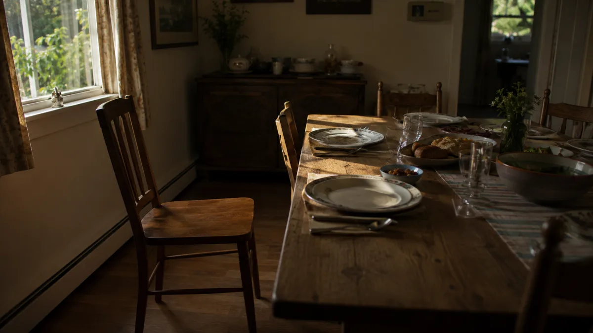 Empty chair at a family dining table representing the absence of a plan after an unexpected death