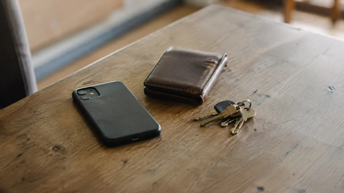 Phone privacy and bank card on table