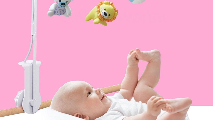 Hang a mobile above your newborn’s crib -- ensure it is always out of her reach -- and pictures around the nursery to catch her eye.